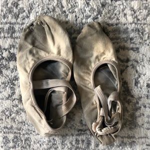 Old hole filled ballet shoes